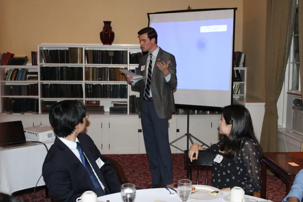 Matthew Jenning ’25 welcomes new delegates on Tap Night.